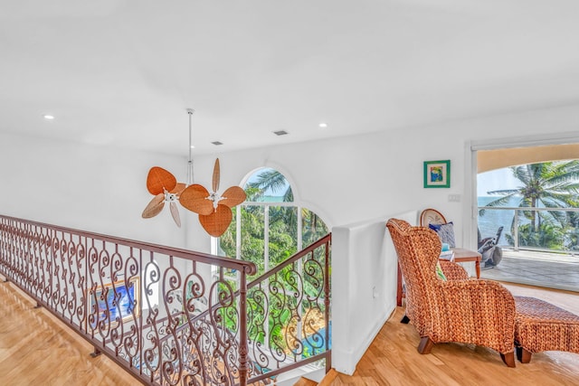 sitting room featuring a ceiling fan, a wealth of natural light, recessed lighting, and wood finished floors