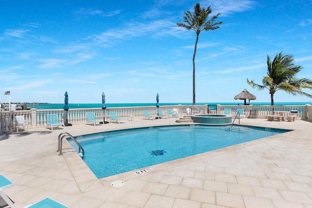 view of swimming pool featuring a patio area