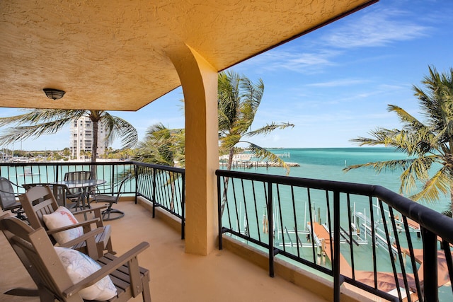 balcony featuring a water view