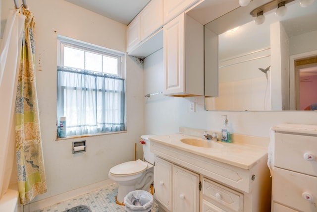 full bath featuring curtained shower, vanity, and toilet