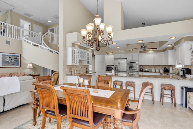 210 14th St, Key Colony, FL 33051 - dining room with recessed lighting, visible vents, a high ceiling, and ceiling fan with notable chandelier