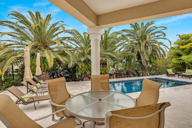 210 14th St, Key Colony, FL 33051 - view of patio with outdoor dining area and an outdoor pool