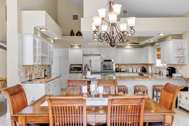 210 14th St, Key Colony, FL 33051 - kitchen featuring backsplash, visible vents, stainless steel appliances, and a sink