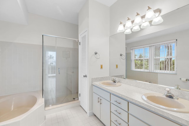 bathroom with a sink, a shower stall, a bath, and double vanity