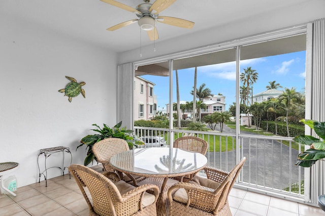 sunroom featuring ceiling fan