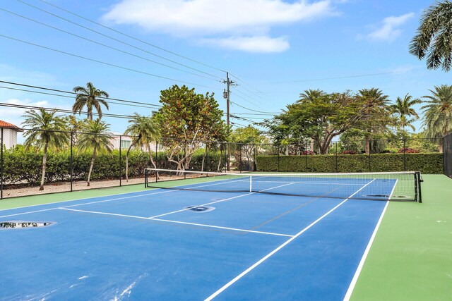 view of tennis court with fence