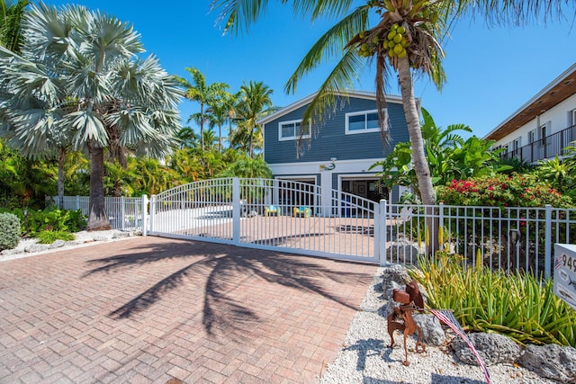 view of front of property with a gate and fence