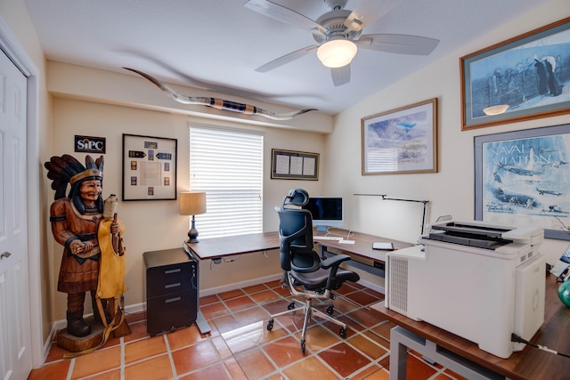 office space with a ceiling fan, baseboards, and tile patterned floors