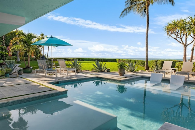 outdoor pool with a patio area