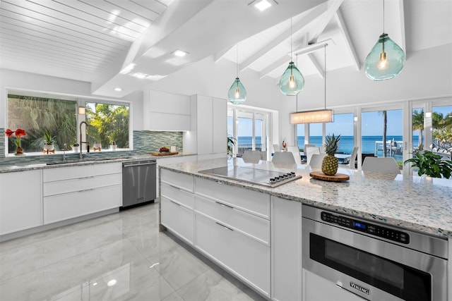 kitchen with vaulted ceiling with beams, black electric stovetop, white cabinets, stainless steel dishwasher, and backsplash