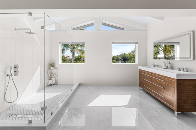 bathroom featuring lofted ceiling with beams, double vanity, a shower stall, and a wealth of natural light