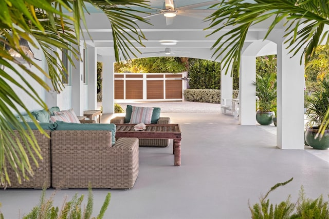 view of patio / terrace with fence, outdoor lounge area, and a ceiling fan