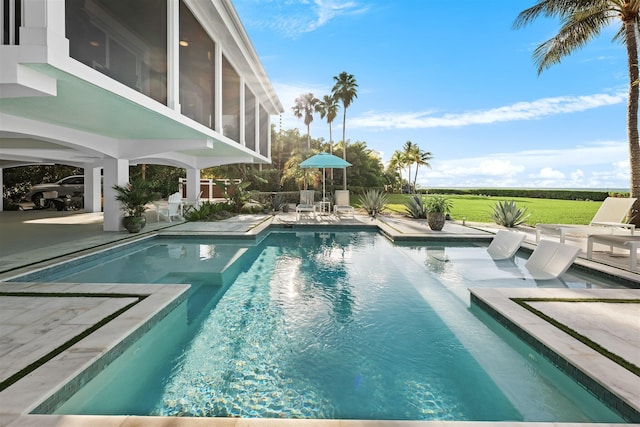 outdoor pool featuring a patio