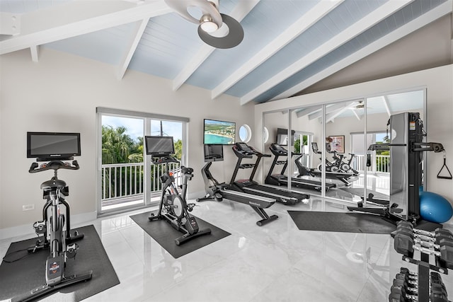 exercise room featuring lofted ceiling and baseboards