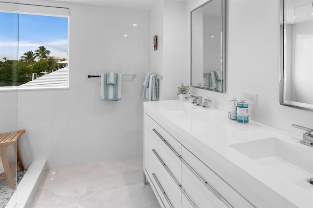 bathroom with double vanity and a sink