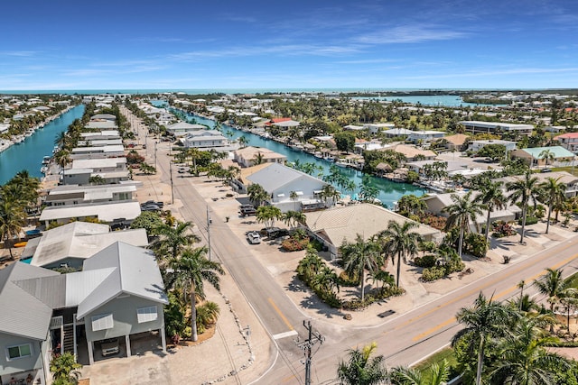 bird's eye view featuring a water view and a residential view