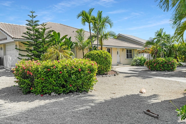 single story home featuring fence and stucco siding