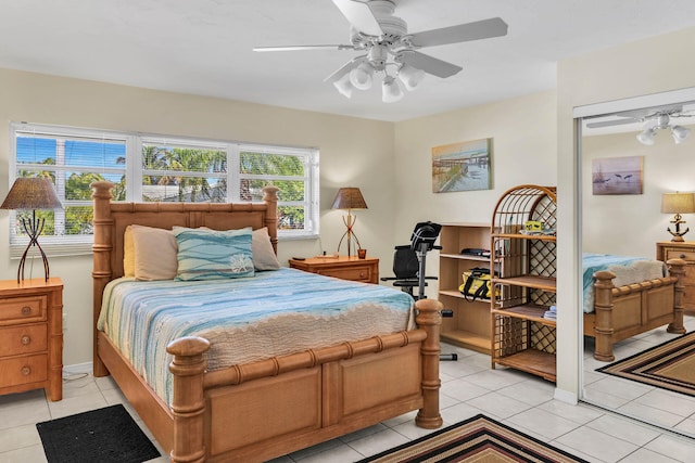 bedroom with ceiling fan and light tile patterned floors