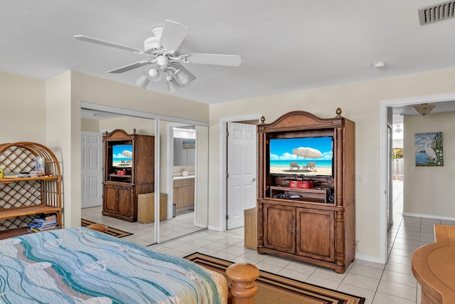 bedroom with light tile patterned floors, baseboards, visible vents, and a ceiling fan