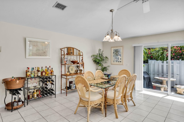 dining area featuring visible vents, an inviting chandelier, and light tile patterned floors