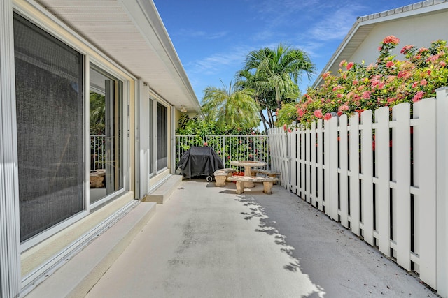 view of patio featuring fence