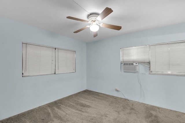 spare room with ceiling fan, carpet, and cooling unit