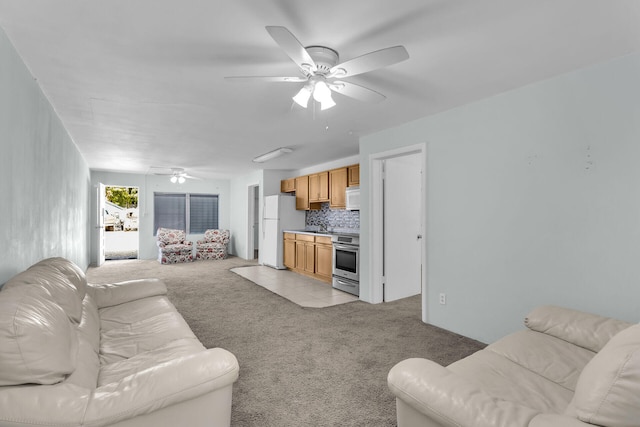 living room with light carpet and a ceiling fan