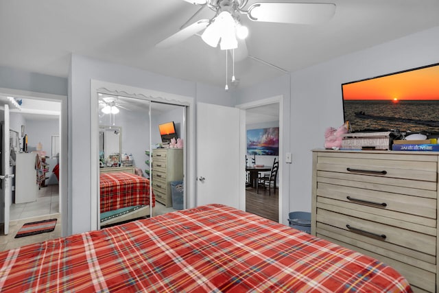 bedroom with a ceiling fan and a closet