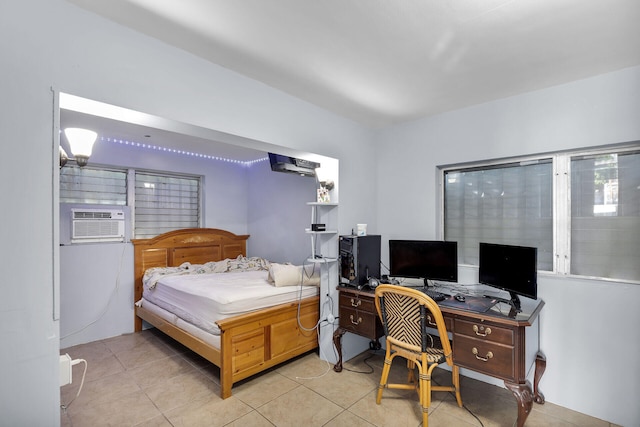 bedroom featuring light tile patterned floors and cooling unit