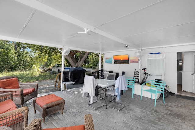view of patio / terrace with outdoor dining space, ceiling fan, and grilling area