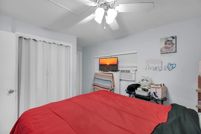 bedroom featuring cooling unit and a ceiling fan
