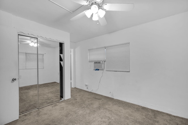 unfurnished bedroom with ceiling fan, carpet floors, and a closet