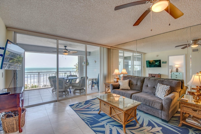1901 Roosevelt Blvd Unit 404S, Key West, FL 33040 - tiled living room with a healthy amount of sunlight, a ceiling fan, and floor to ceiling windows