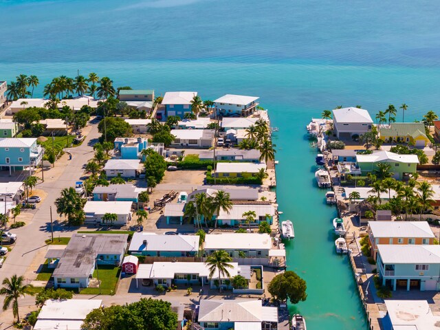 drone / aerial view featuring a water view and a residential view