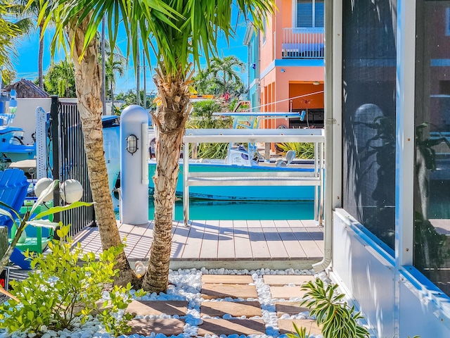 view of pool featuring a boat dock