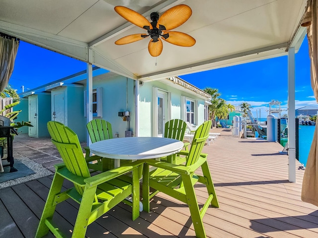 deck with a ceiling fan and outdoor dining space