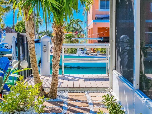 view of pool with a boat dock