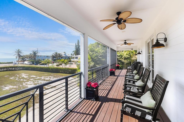wooden deck with ceiling fan