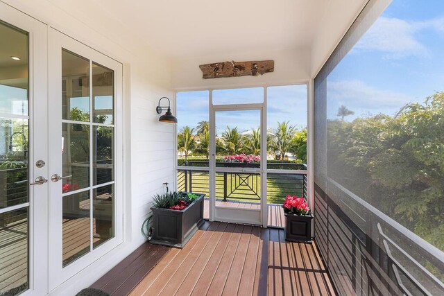 sunroom featuring french doors