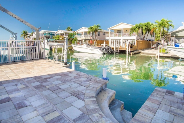 exterior space featuring a water view and a boat dock