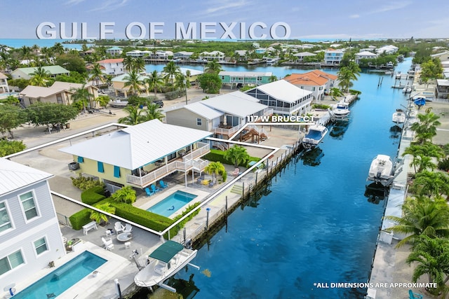 aerial view featuring a residential view and a water view
