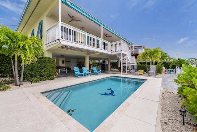 back of house with a patio area, ceiling fan, stairway, and an outdoor pool