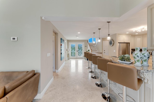 interior space with french doors, recessed lighting, baseboards, and stairs