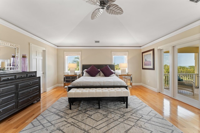 bedroom featuring access to outside, visible vents, and light wood-style flooring