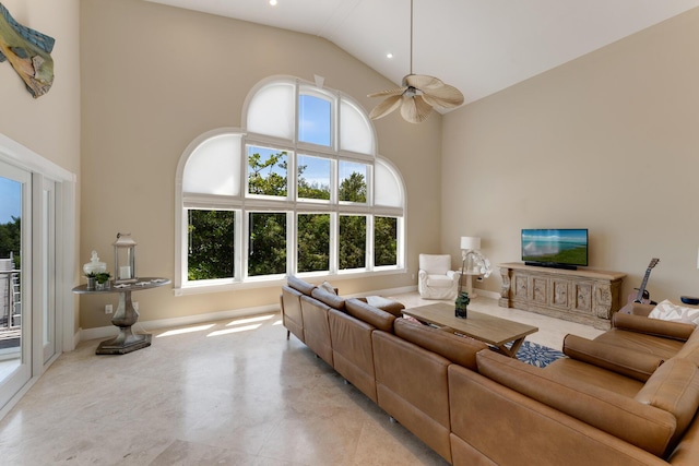 living room with high vaulted ceiling, baseboards, and a ceiling fan