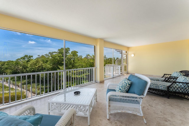 sunroom featuring outdoor lounge area