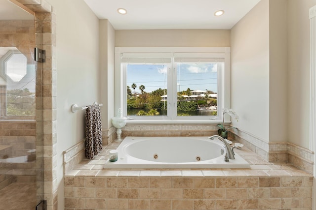 bathroom featuring a shower stall, recessed lighting, and a jetted tub