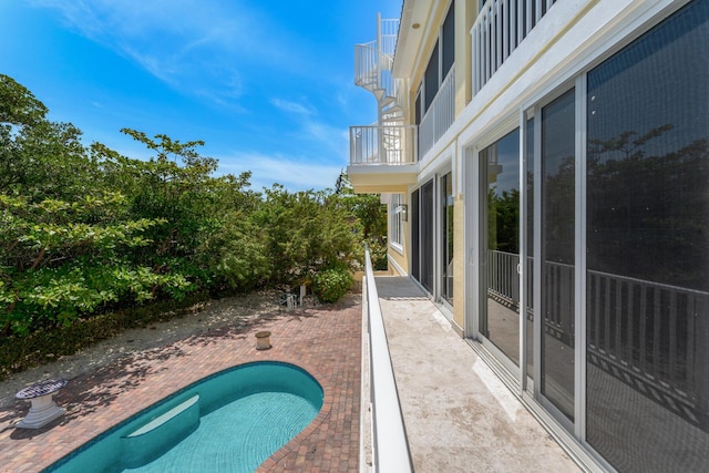view of swimming pool with a fenced in pool and a patio area
