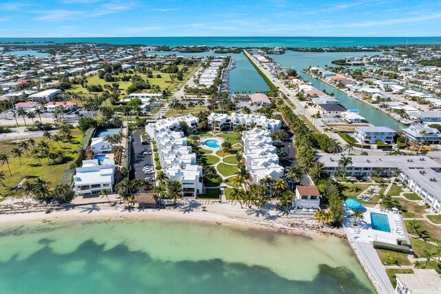 601 Ocean Dr Unit 411C, Key Colony, FL 33051 - drone / aerial view of a nearby body of water and a pool area