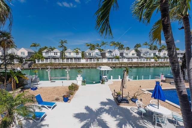 property view of water with a residential view and a boat dock